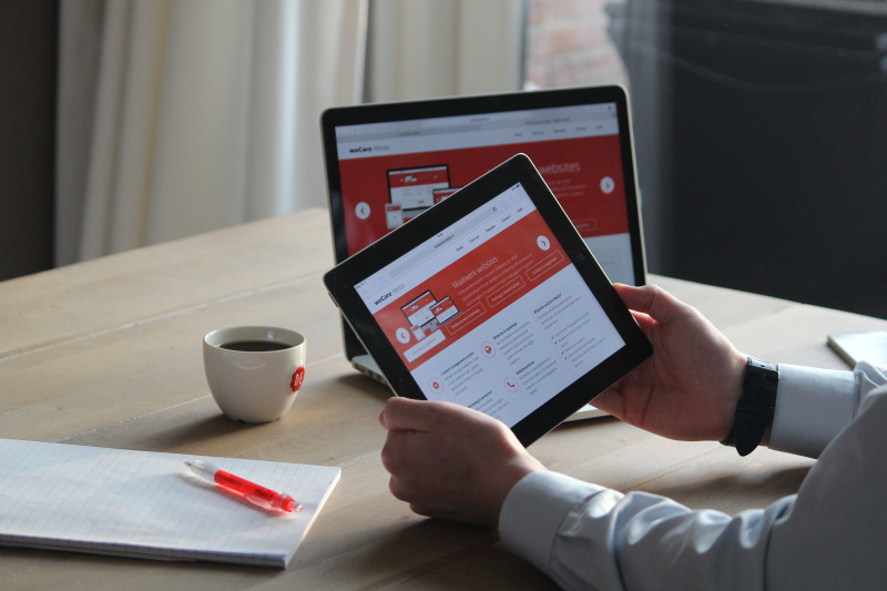 Small business owner choosing a website template on a tablet